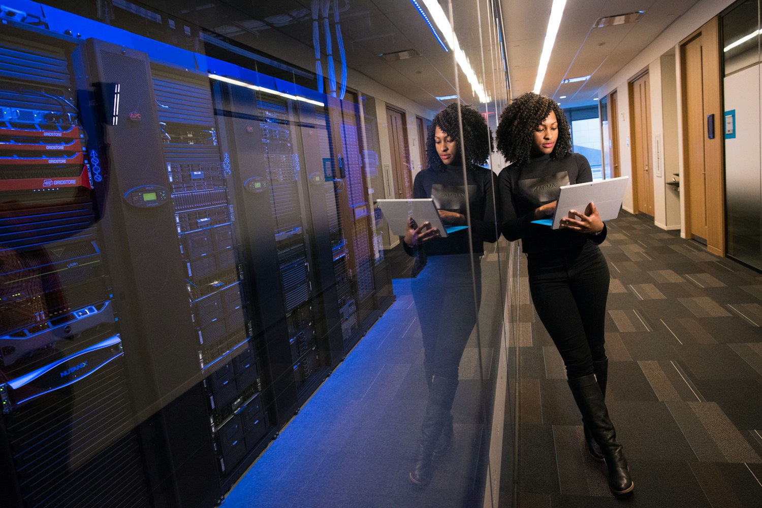 Kyzen technology specialists collaborating in a digital command center